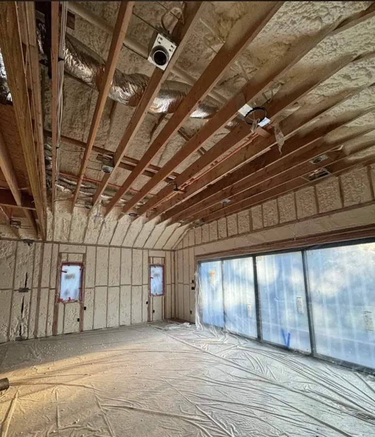 Interior walls and ceiling insulated with spray foam during new construction in Huntington